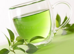 healthy green tea cup with tea leaves